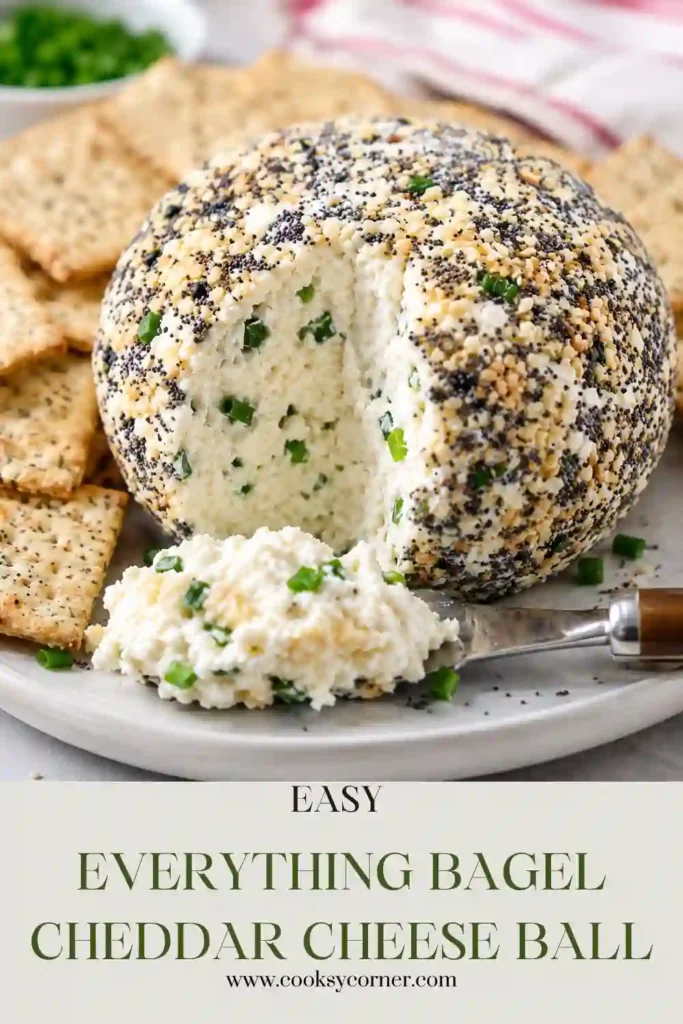 Homemade Everything Bagel Cheddar Cheese Ball made with cream cheese, sharp cheddar, and green onions. The no-bake appetizer is chilled until firm and ready to serve.