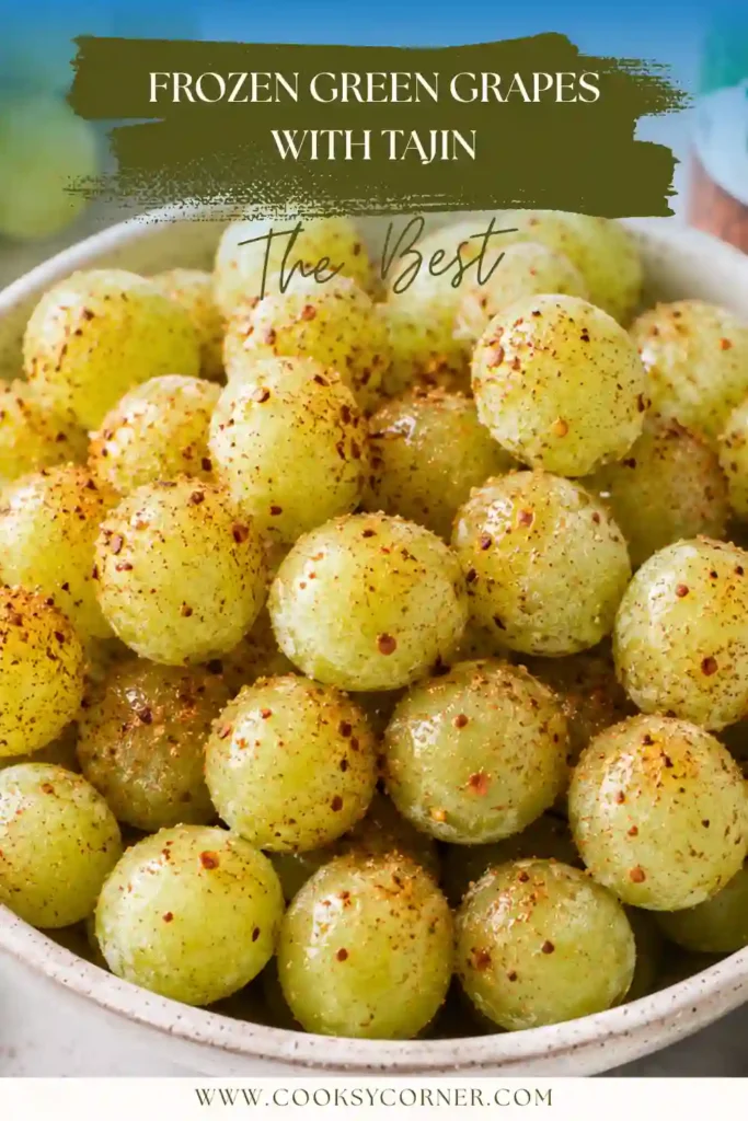 Close-up of Frozen Green Grapes with Tajin showing the sweet and spicy seasoning coating each frozen grape. A refreshing healthy fruit snack.