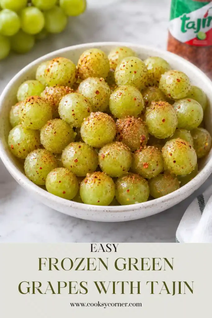 A bowl filled with Frozen Green Grapes with Tajin featuring juicy grapes covered in chamoy and Tajin seasoning. An easy Mexican-inspired frozen snack.