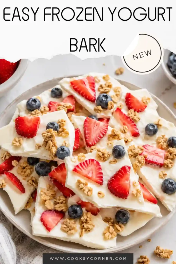 Close-up of Frozen Yogurt Bark featuring creamy vanilla yogurt, juicy strawberries, blueberries, and crunchy granola in every piece.