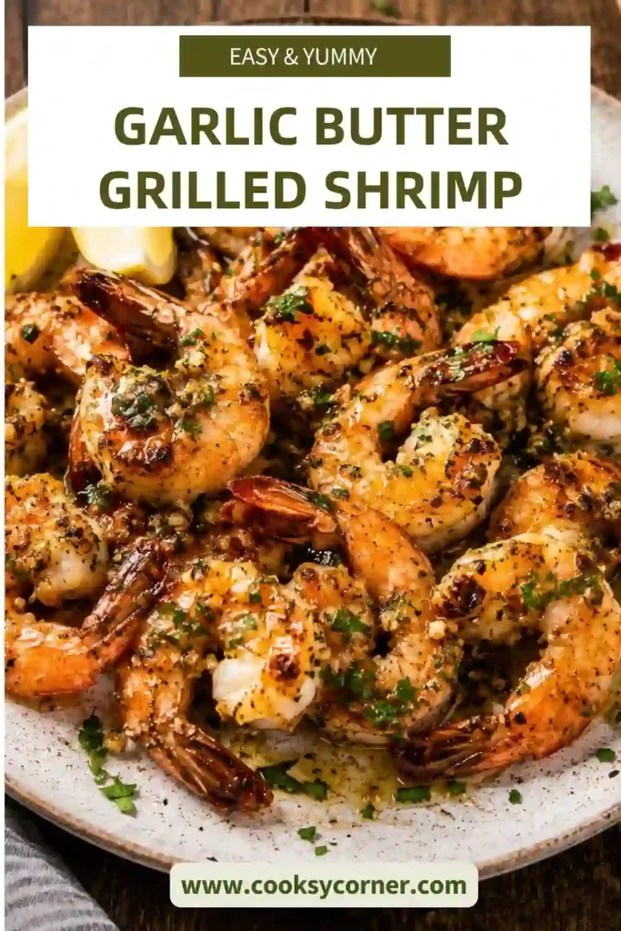 Garlic Butter Grilled Shrimp skewers brushed with melted garlic butter, garnished with fresh parsley, and served with lemon wedges on a white serving platter.
