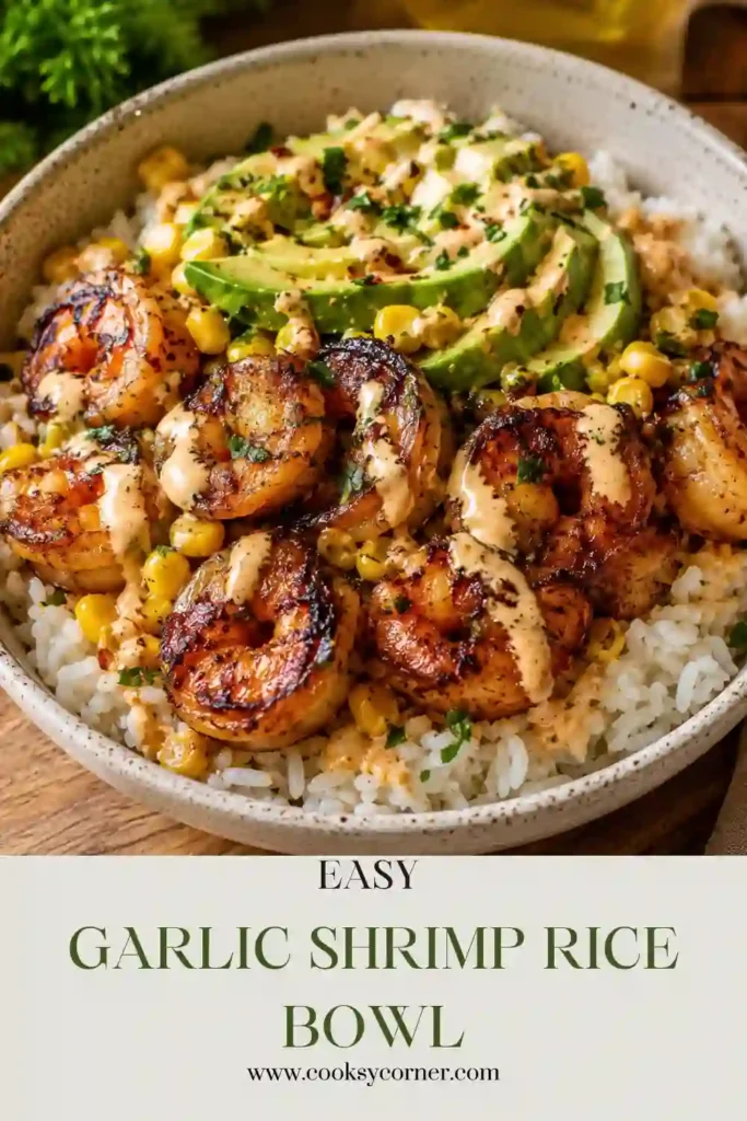 A colorful Garlic Shrimp Rice Bowl filled with seasoned shrimp, fluffy white rice, creamy avocado, sweet corn, cherry tomatoes, and fresh cilantro. This healthy shrimp bowl makes an easy seafood dinner for busy weeknights.