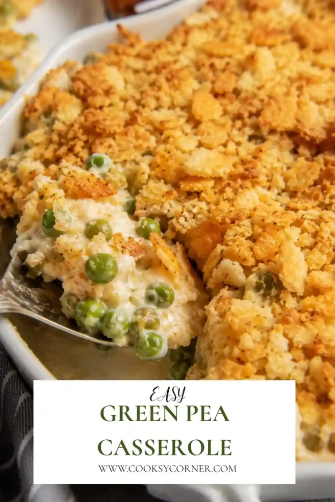A baked Green Pea Casserole topped with golden buttery cracker crumbs and melted cheddar cheese. This creamy holiday side dish is served warm in a classic casserole dish.