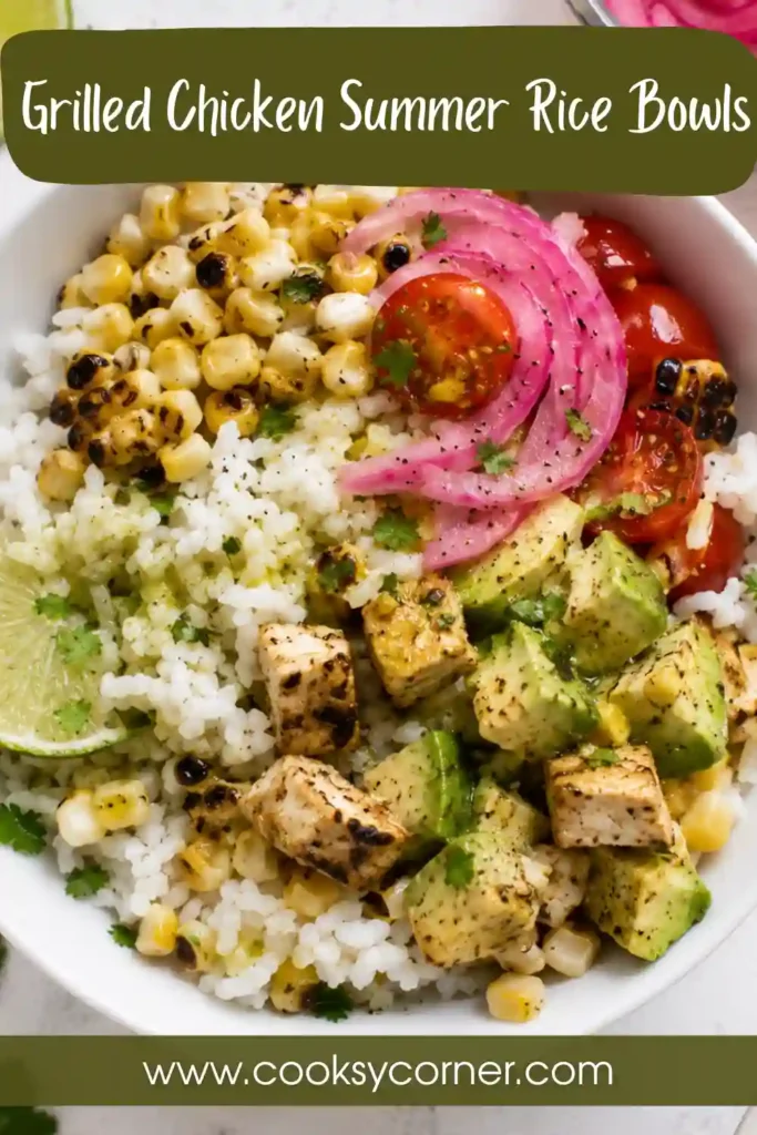 Fresh summer rice bowl with grilled chicken, avocado, corn, tomatoes, and pickled onions served over jasmine rice with cilantro lime dressing.