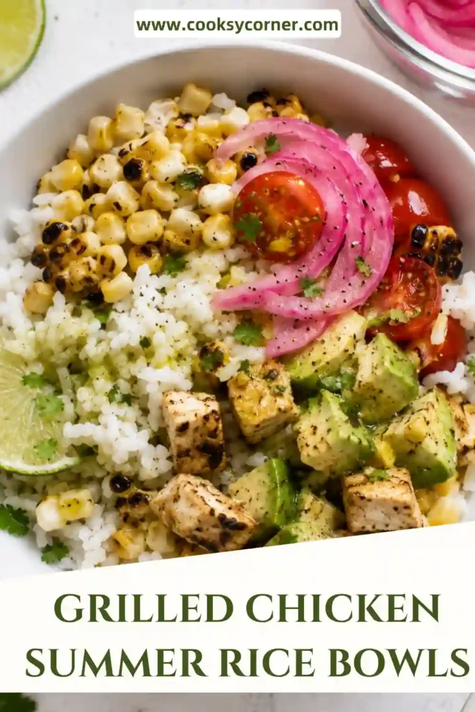 Grilled Chicken Summer Rice Bowls filled with cilantro lime grilled chicken, jasmine rice, sweet corn, avocado, tomatoes, and pickled onions topped with fresh herbs.
