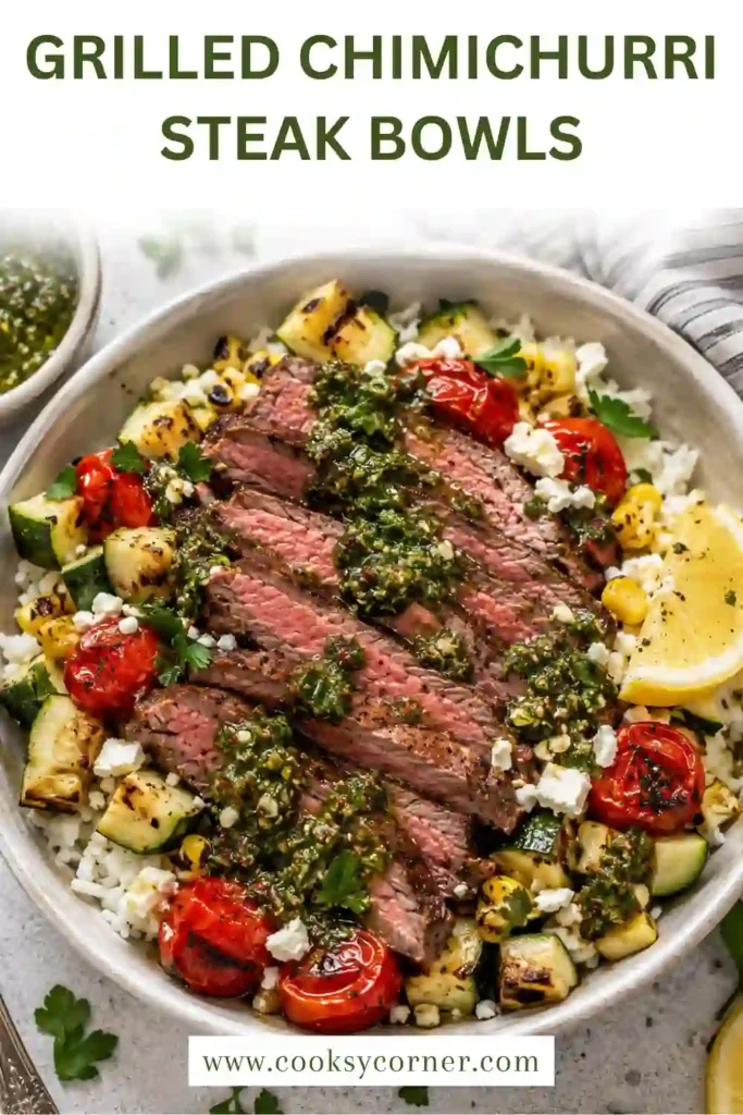 A Grilled Chimichurri Steak Bowl filled with sliced grilled flank steak, charred corn, zucchini, tomatoes, herb rice, greens, and fresh chimichurri sauce. The colorful bowl is finished with Cotija cheese and herbs.