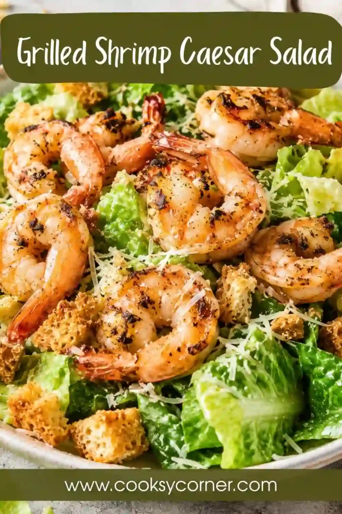 A Grilled Shrimp Caesar Salad served with crisp romaine lettuce, grilled Old Bay shrimp, homemade seasoned breadcrumbs, Parmesan cheese, and creamy Caesar dressing.