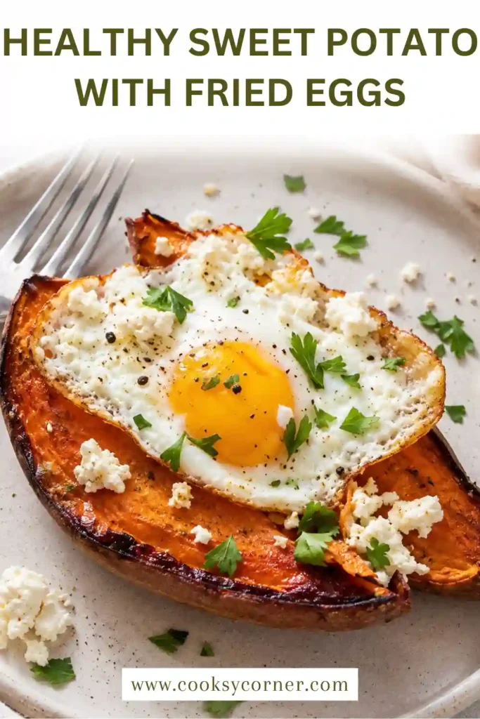 Healthy Sweet Potato Breakfast with Fried Eggs garnished with za'atar, Aleppo pepper, feta cheese, and herbs. Warm roasted sweet potatoes create a satisfying morning meal.
