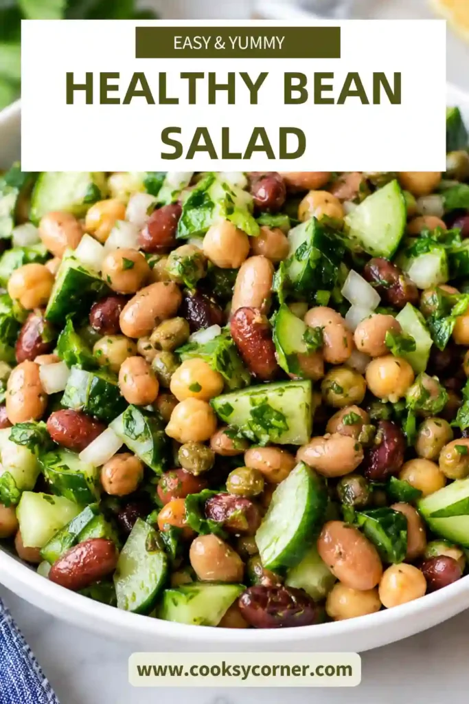 Healthy Easy Bean Salad served in a bowl with mixed beans, chopped cucumber, fresh herbs, and vinaigrette. A delicious vegetarian side dish full of flavor.