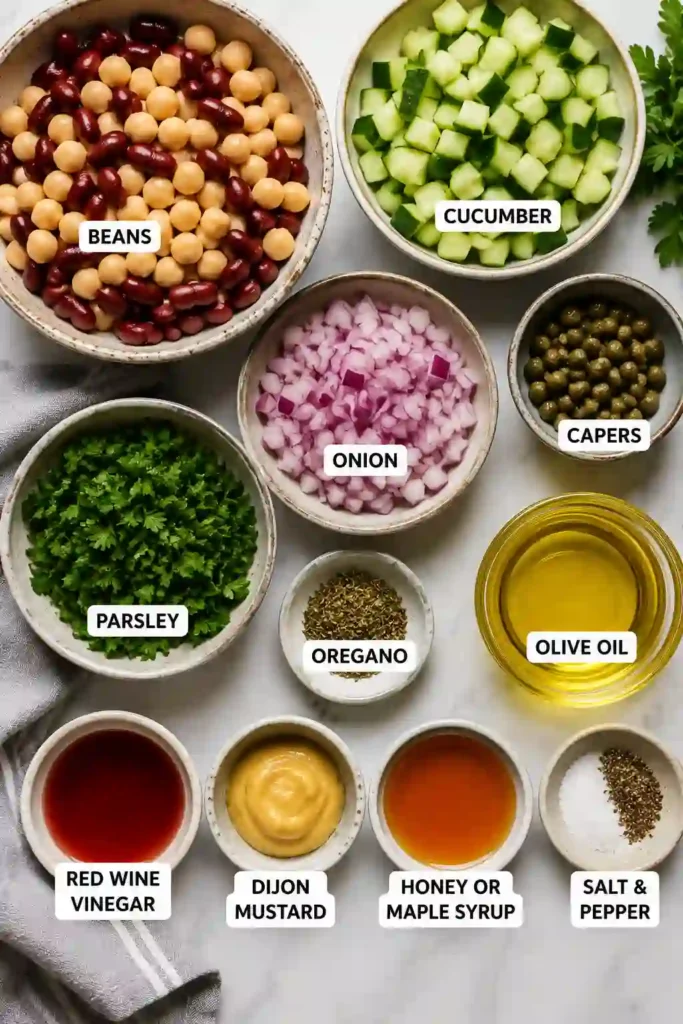 Colorful Easy Bean Salad with marinated beans, parsley, capers, and cucumber tossed in a light dressing. Perfect for lunches, potlucks, and family dinners.
