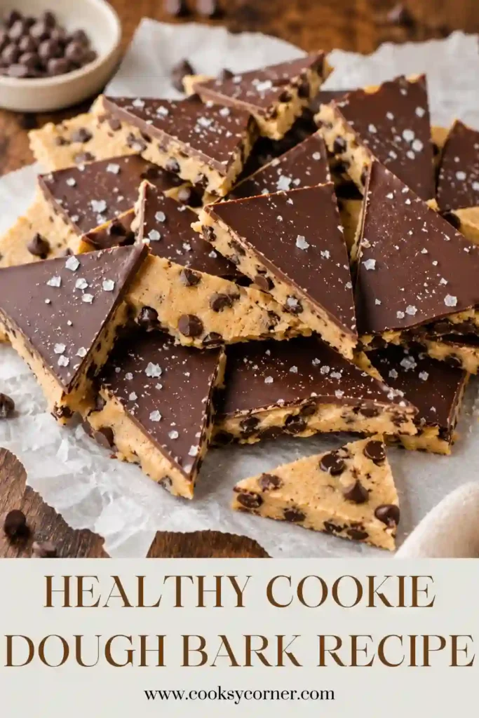 Homemade Healthy Cookie Dough Bark served on parchment paper with chocolate chips and almond flour visible in the background.