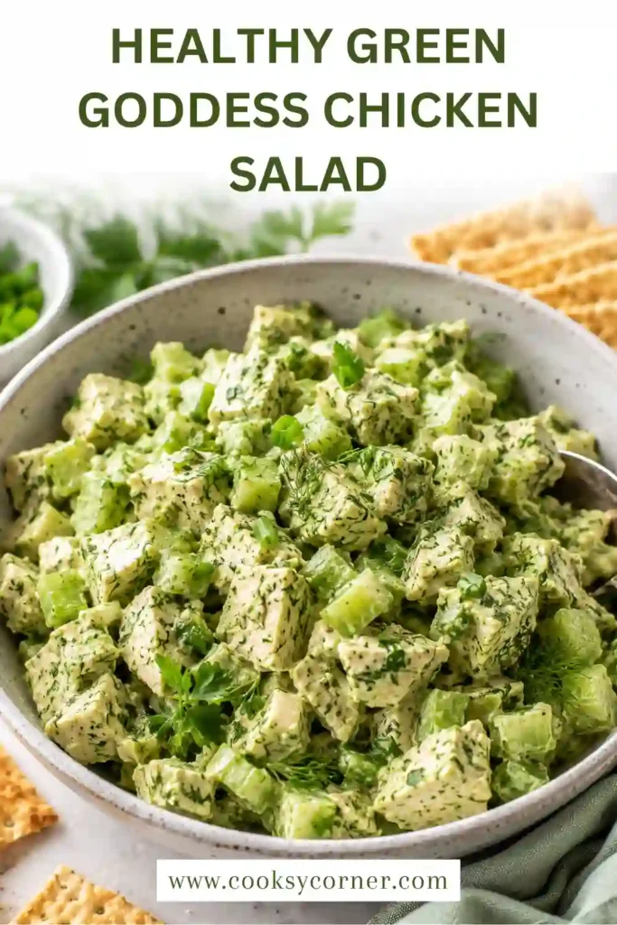 Creamy avocado chicken salad with chopped celery, parsley, dill, and chives served in a rustic bowl. A healthy high-protein lunch made with fresh ingredients.