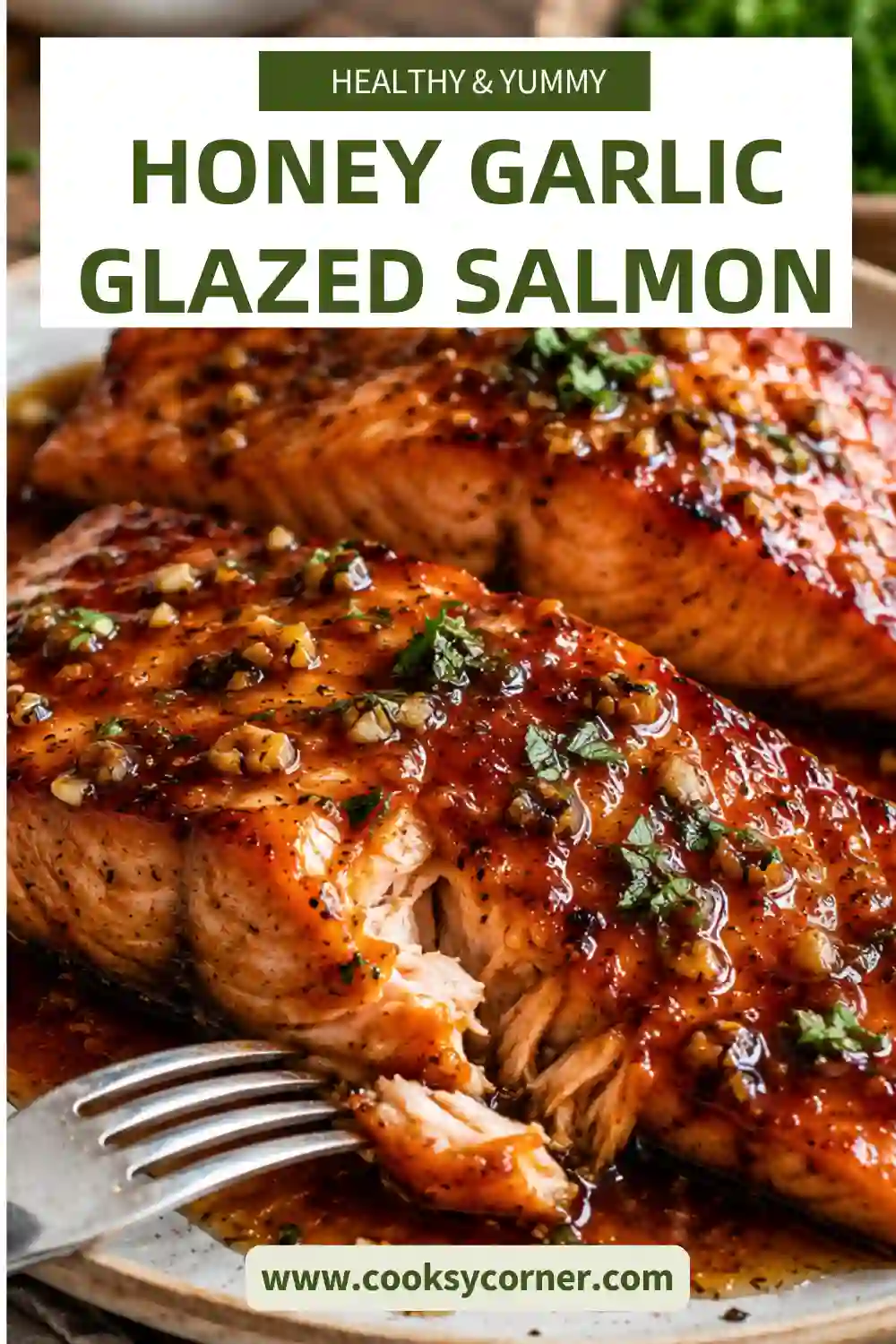 Honey Garlic Glazed Salmon plated with roasted asparagus, lemon wedges, and parsley on a white dinner plate.