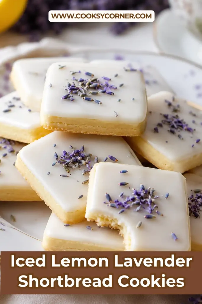 Freshly baked Iced Lemon Lavender Shortbread Cookies decorated with smooth lemon icing and dried culinary lavender. These buttery lemon lavender cookies are perfect for elegant afternoon tea.
