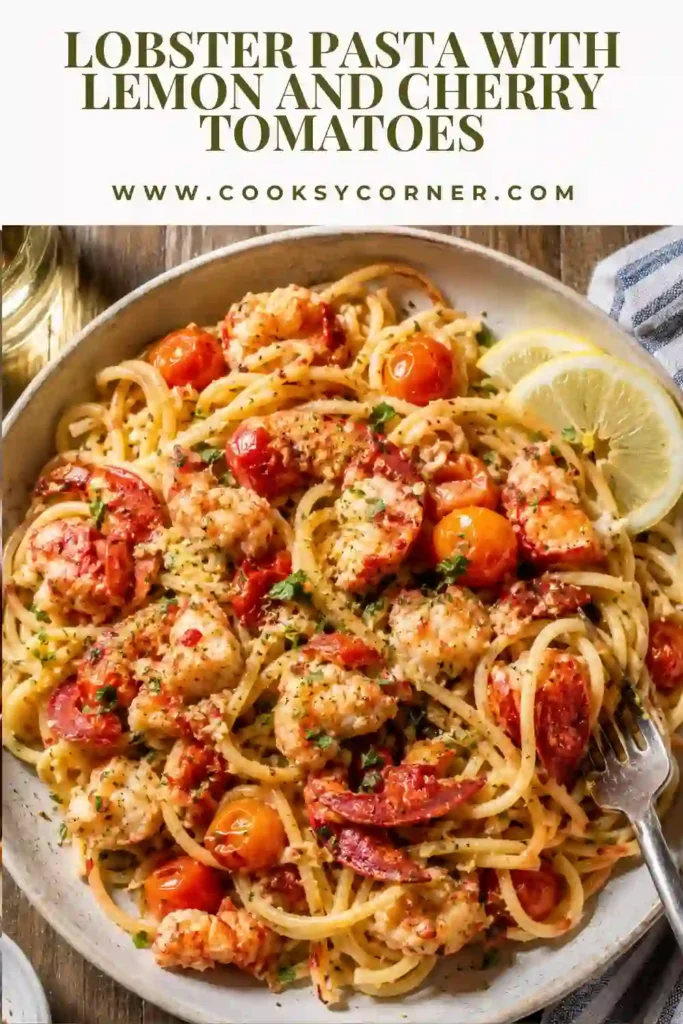 A plate of lobster pasta with juicy cherry tomatoes, fresh parsley, and grated Parmesan served with lemon wedges. The pasta is coated in a light, glossy tomato sauce.