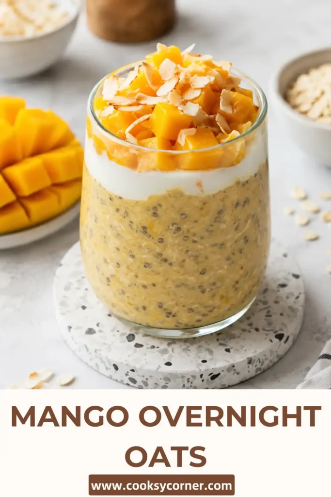 Healthy Mango Overnight Oats with fresh mango, rolled oats, chia seeds, and coconut flakes in a mason jar. A refreshing no-cook breakfast for busy mornings.