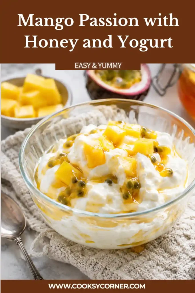 Healthy mango yogurt dessert featuring creamy Greek yogurt, passion fruit seeds, honey, and diced mango.
