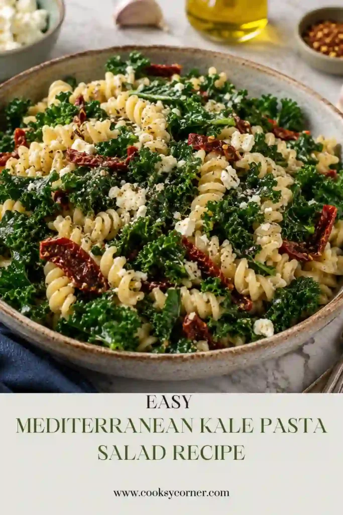 Mediterranean Kale Pasta Salad made with rotini pasta, fresh kale, feta cheese, Parmesan, and sun-dried tomatoes tossed in a homemade pesto dressing. This colorful vegetarian pasta salad is fresh and satisfying.