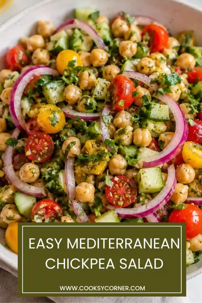 Healthy vegan Chickpea Salad served in a bowl with fresh mint, parsley, and dill. Bright lemon dressing brings together every fresh ingredient beautifully.