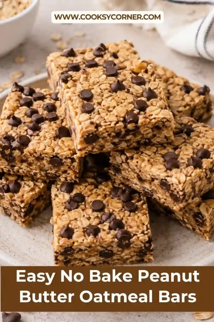 A plate of No Bake Peanut Butter Oatmeal Bars cut into squares with a chewy oat texture and chocolate chips throughout. An easy homemade snack recipe for the whole family.
