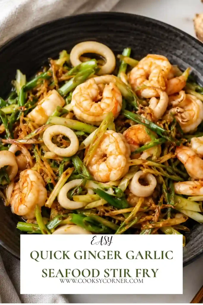 Quick Ginger Garlic Seafood Stir Fry served with mixed seafood, fresh ginger, garlic, and spring onions in a wok.