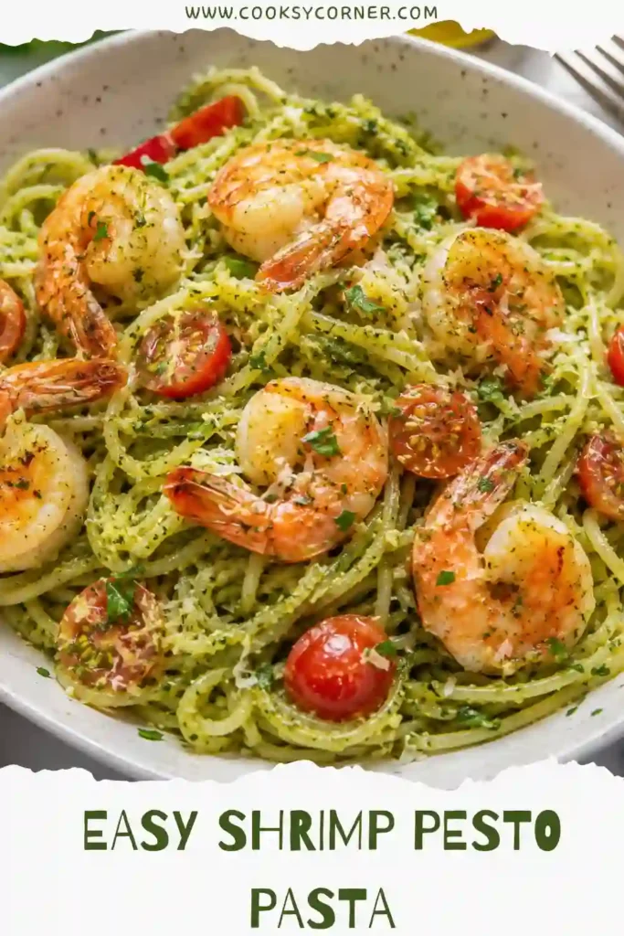 Easy basil pesto shrimp pasta served in a white bowl with cherry tomatoes and fresh parsley. This quick seafood pasta is perfect for busy weeknight dinners.