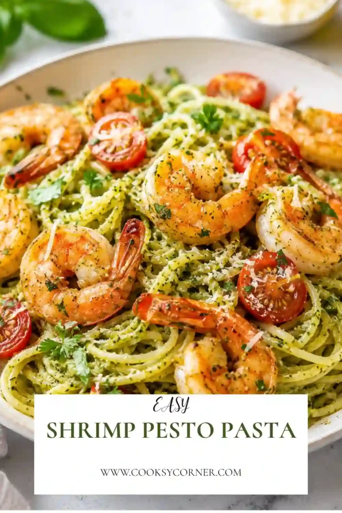 A bowl of Shrimp Pesto Pasta made with spaghetti, basil pesto, juicy shrimp, cherry tomatoes, and grated Parmesan cheese. This easy seafood pasta is fresh, colorful, and perfect for a quick family dinner.
