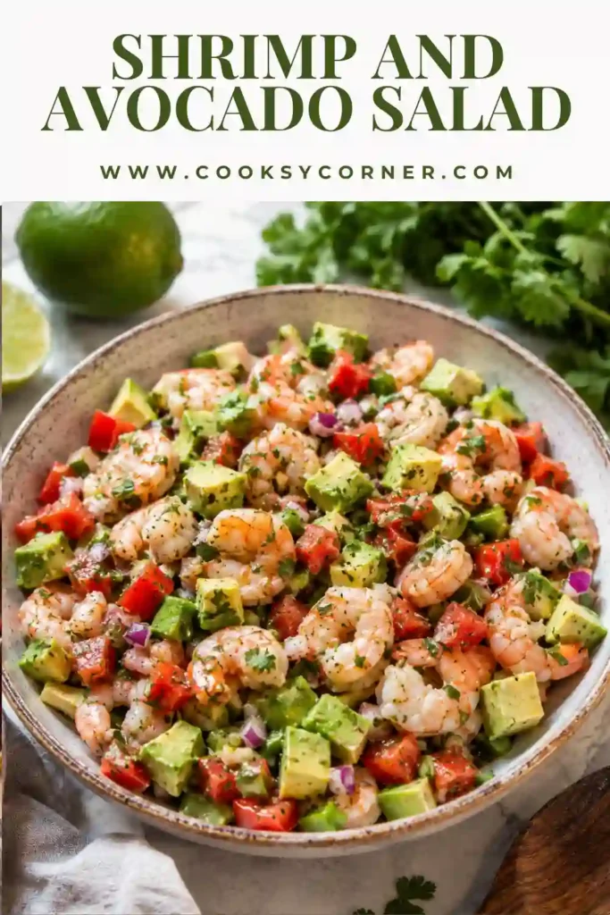 A bowl of Shrimp and Avocado Salad made with cooked shrimp, diced avocado, tomatoes, cilantro, jalapeño, and fresh lime. A colorful, healthy seafood salad ready to serve.