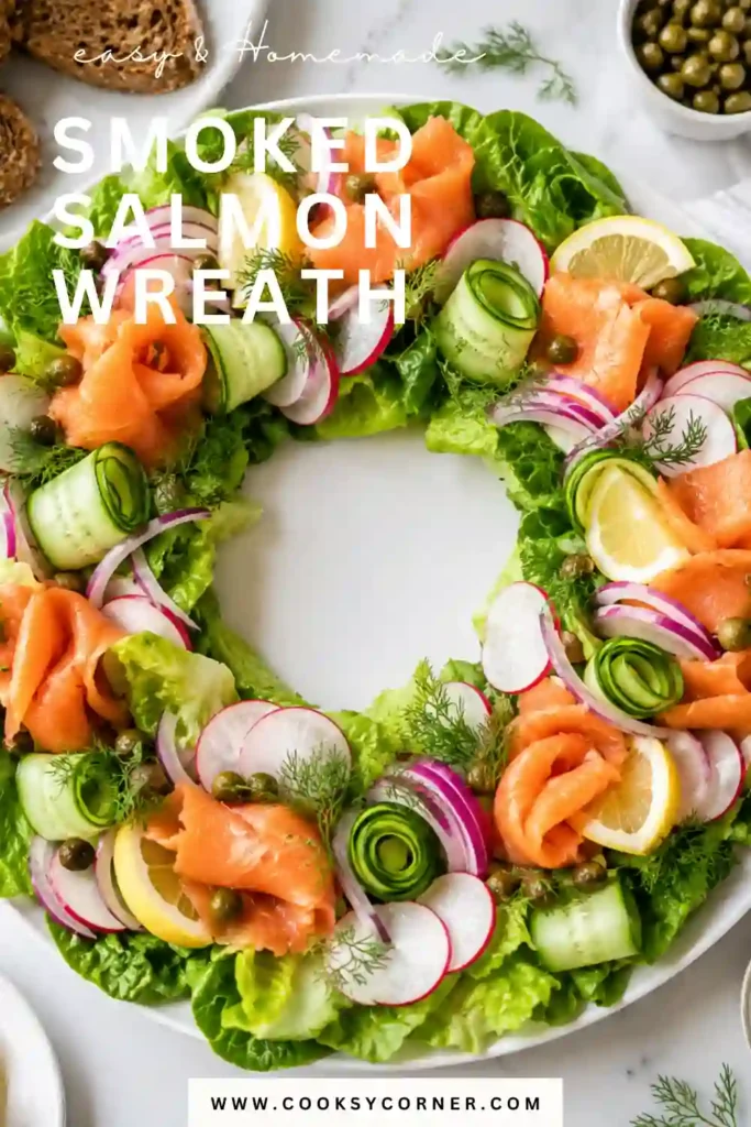 A festive Smoked Salmon Wreath arranged with crisp romaine lettuce, smoked salmon, cucumbers, radishes, capers, and lemon wedges around a creamy dill sauce. This elegant holiday appetizer is colorful and perfect for Christmas entertaining.