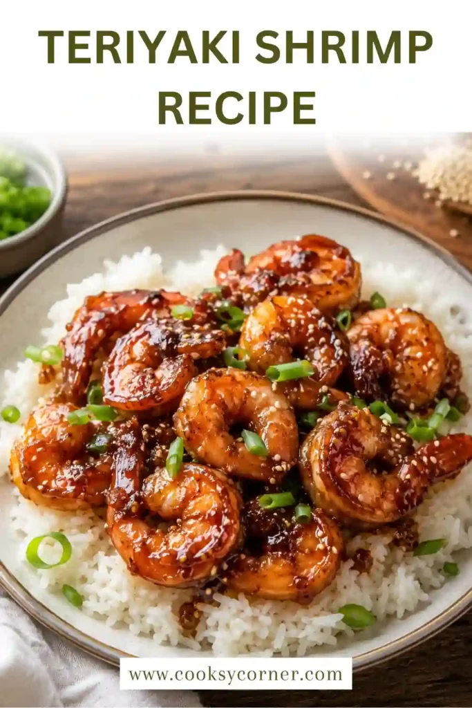 Teriyaki Shrimp served over steamed white rice with broccoli, sesame seeds, and green onions. The shrimp are coated in a glossy homemade teriyaki sauce.
