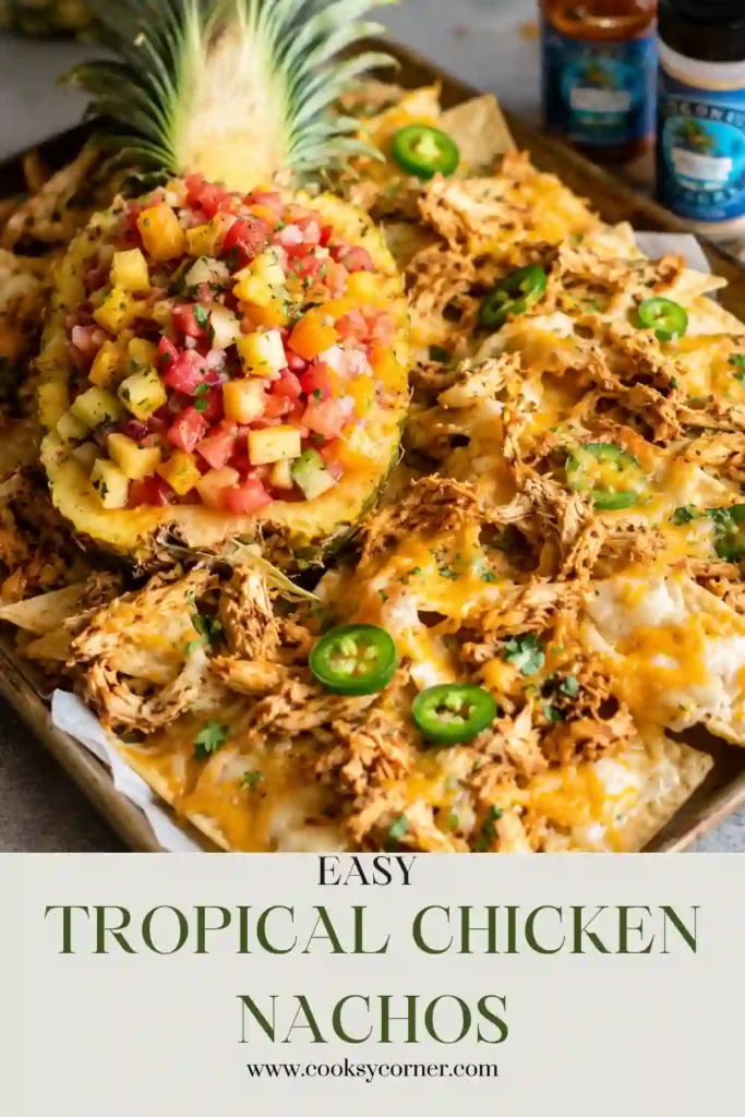 Freshly baked Tropical Chicken Nachos garnished with cilantro and jalapeños alongside homemade tropical salsa bursting with colorful fruit.