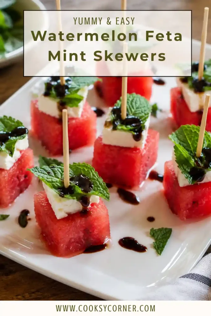 Watermelon Feta Mint Skewers layered with juicy watermelon, creamy feta cheese, fresh mint leaves, and drizzled with homemade balsamic glaze on a serving platter.