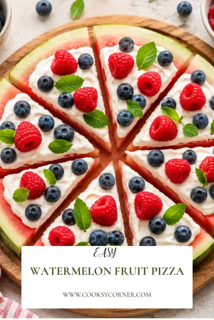 A round Watermelon Fruit Pizza topped with creamy vanilla Greek yogurt and colorful fresh mixed berries, sliced into wedges. This healthy no-bake dessert is perfect for summer parties and family gatherings.