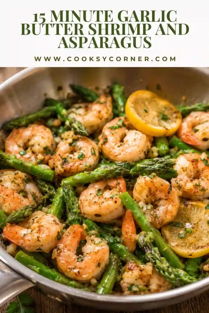 15-Minute Garlic Butter Shrimp and Asparagus with juicy pink shrimp and crisp green asparagus in a lemon garlic butter sauce. Fresh parsley and lemon slices finish the colorful skillet dinner.