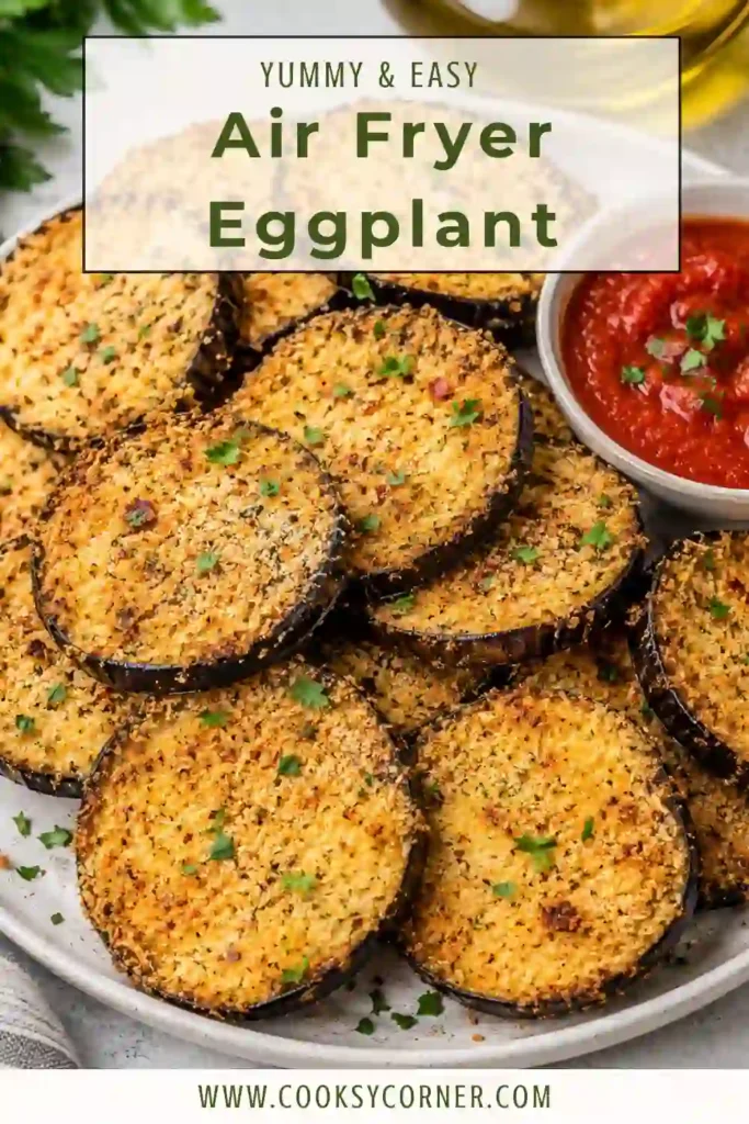 Golden breaded air fryer eggplant slices served with tomato dipping sauce and fresh basil. This healthy eggplant snack is crispy without deep frying.