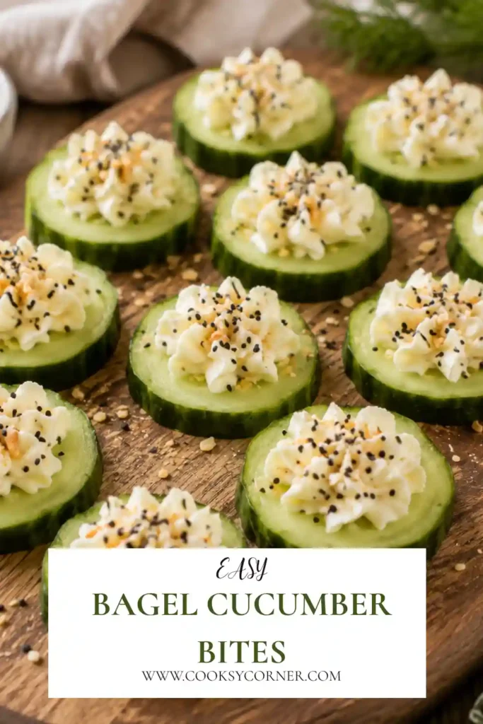 Everything Bagel Cucumber Bites topped with piped cream cheese and savory sesame, poppy seed, garlic, and onion seasoning. The fresh cucumber rounds are arranged on a serving platter.