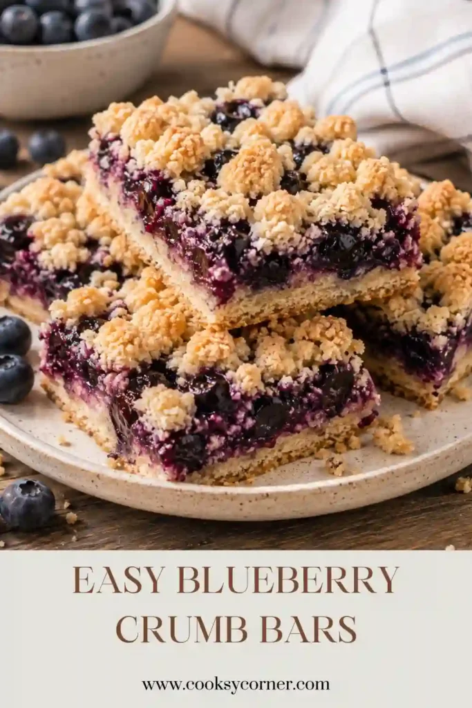 Blueberry Crumb Bars featuring layers of buttery crumb crust, jammy blueberry filling, and crisp cinnamon crumble. Fresh lemon adds brightness to this easy blueberry dessert.