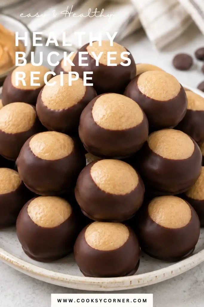 Healthy Buckeyes Recipe featuring creamy peanut butter and almond flour centers partially dipped in smooth chocolate. These no bake buckeyes are finished with the classic peanut butter top showing.