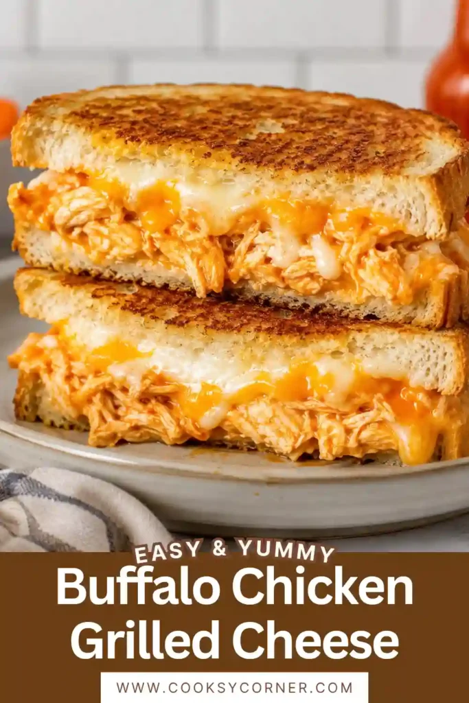 Crispy buffalo chicken grilled cheese sandwich sliced in half to reveal tender chicken, buffalo sauce, ranch, and melted cheese. The toasted bread is golden brown and buttery.