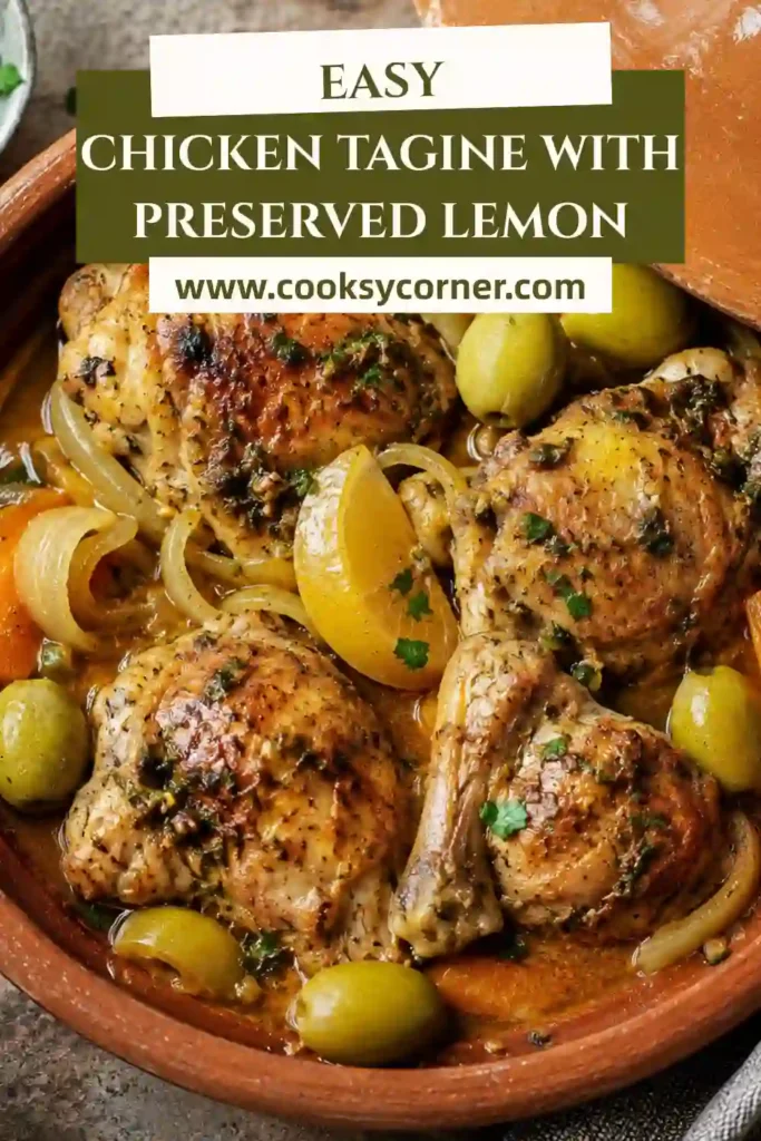 3. Homemade Chicken Tagine with Preserved Lemon topped with fresh cilantro and parsley. Green olives and vegetables surround tender pieces of Moroccan-spiced chicken.