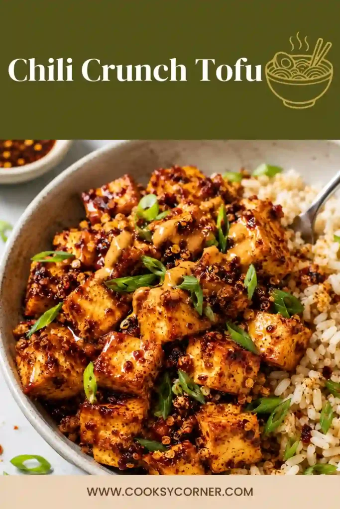 Freshly baked Chili Crunch Tofu served in a rice bowl with green onions and creamy spicy sauce. Crispy tofu pieces are perfectly golden and coated in rich chili crisp.
