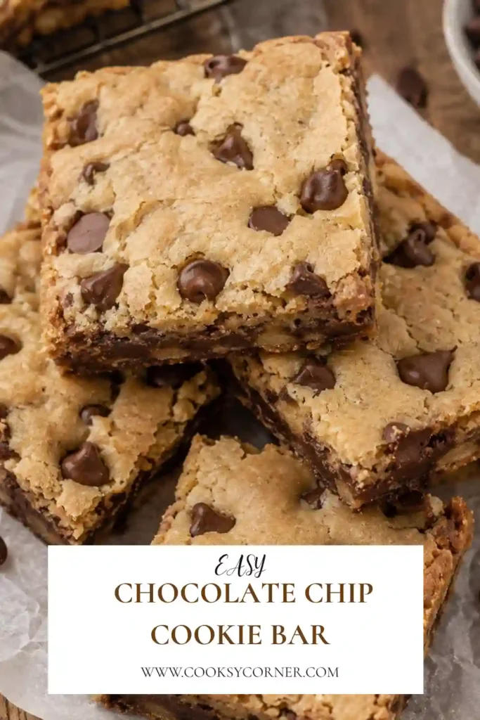 Thick Chocolate Chip Cookie Bars with golden edges and soft centers filled with semi-sweet chocolate chips. The homemade bars are sliced into squares and stacked for serving.