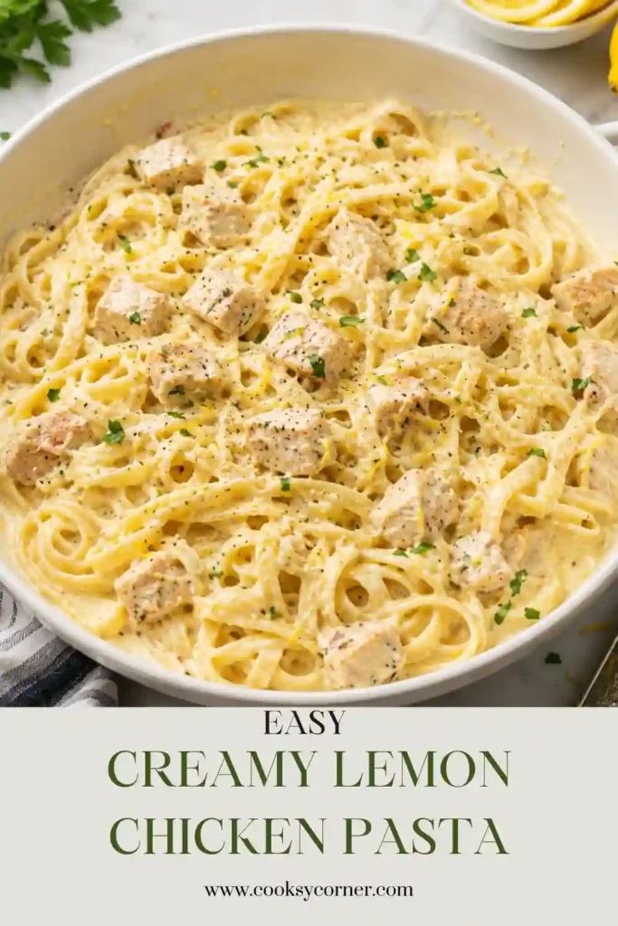 Close-up of Creamy Lemon Chicken Pasta topped with grated Parmesan, parsley, and fresh lemon zest.