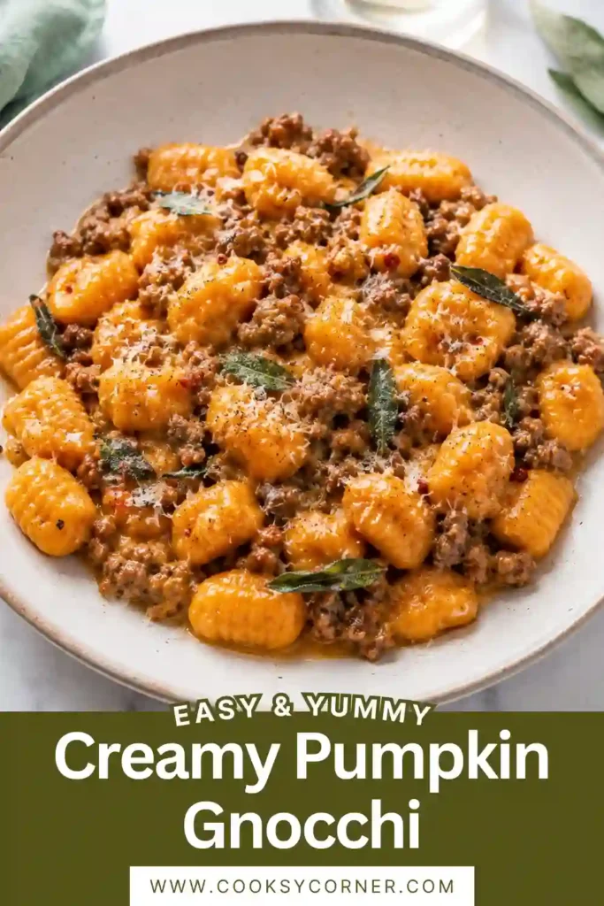 One pan creamy pumpkin gnocchi with browned beef sausage and fresh spinach. The gnocchi are coated in a velvety pumpkin sauce flavored with garlic and herbs.