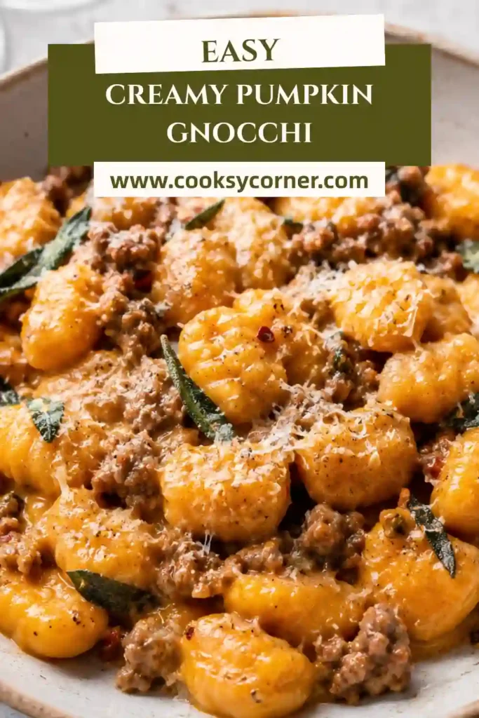 Creamy pumpkin gnocchi with spinach and beef sausage served in a skillet. Tender potato gnocchi are coated in a rich pumpkin cream sauce with fresh sage and thyme.