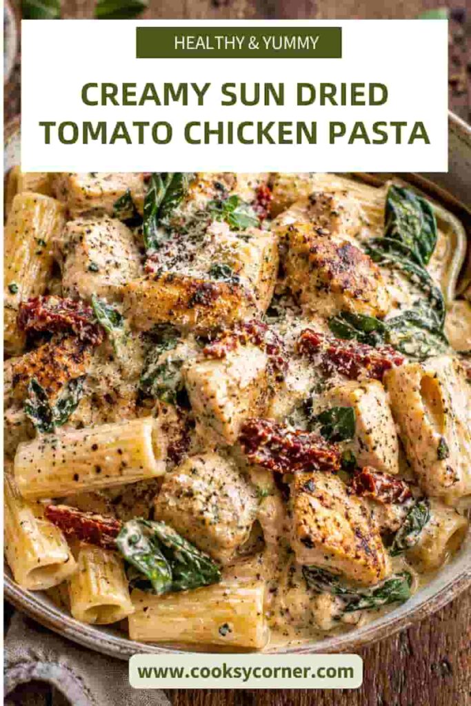 One-pan Creamy Sun-Dried Tomato Chicken Pasta garnished with Parmesan cheese and herbs. Rich, creamy, and packed with Italian-inspired flavors.