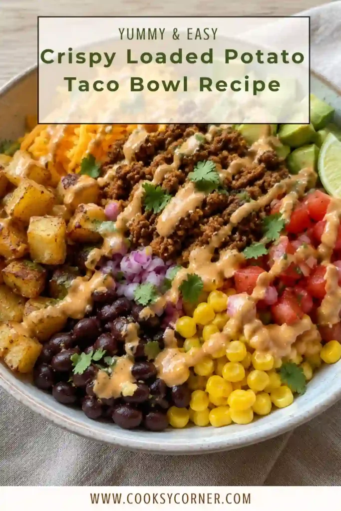 Crispy Loaded Potato Taco Bowl Recipe with golden roasted potatoes, seasoned ground beef, corn, shredded cheddar, guacamole, pico de gallo, and sour cream. The colorful toppings are arranged over crispy potatoes in a serving bowl.