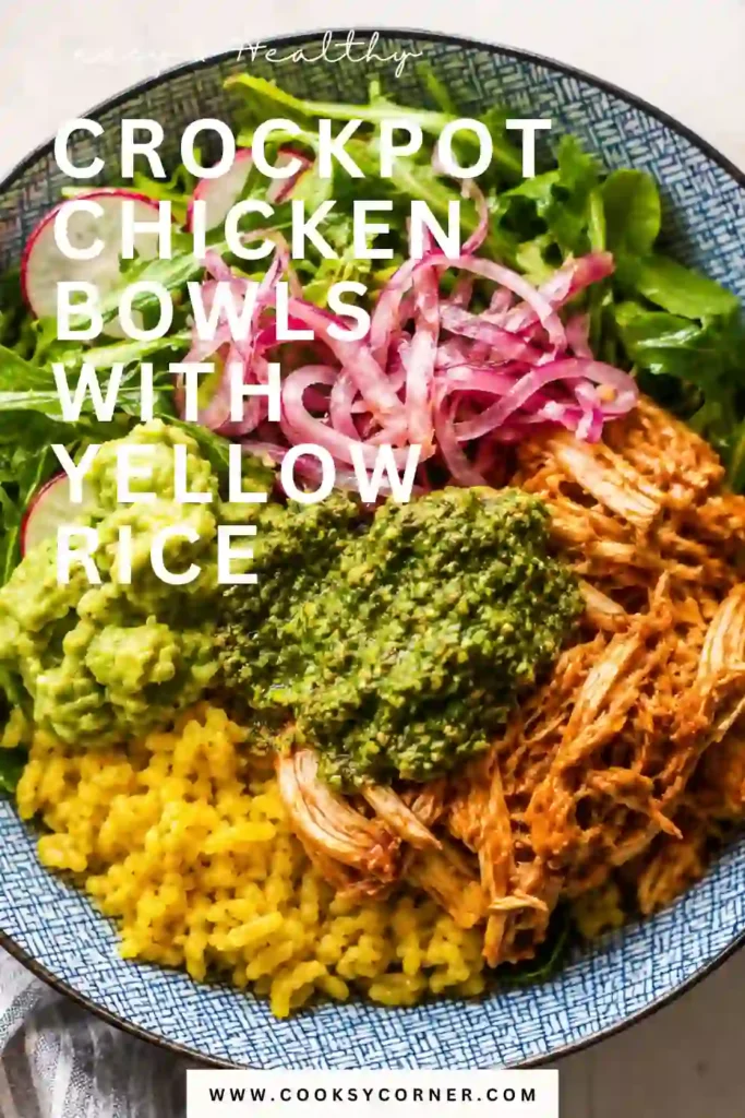 A bowl of Crockpot Chicken Bowls featuring tender shredded slow cooker chicken over yellow rice with fresh cilantro pesto, pickled onions, and crisp greens. This colorful meal is perfect for meal prep and easy family dinners.