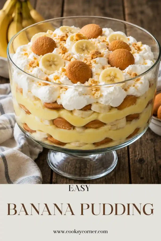 A trifle dish filled with creamy Easy Banana Pudding layered with vanilla wafers, fresh banana slices, and whipped cream.