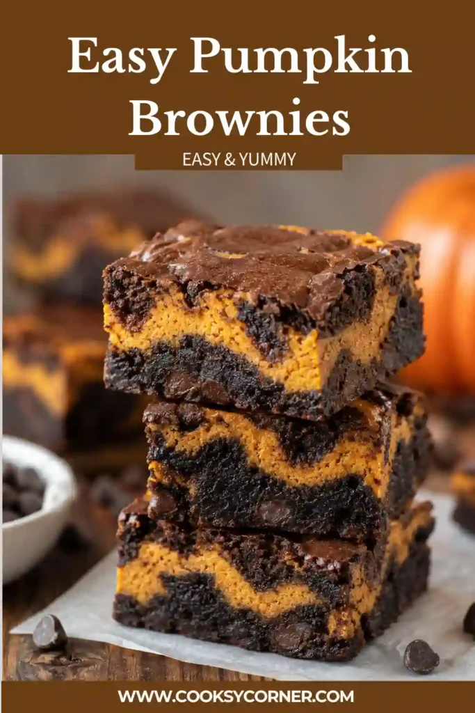 Freshly sliced Easy Pumpkin Brownies featuring fudgy chocolate and a creamy pumpkin cheesecake layer. The swirled pumpkin brownies have a rich texture and warm autumn flavor.
